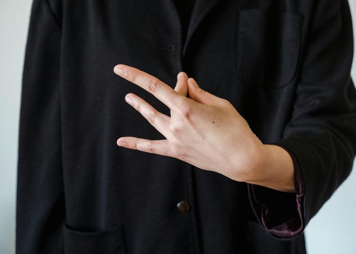 Close up of hands in a meditative mudra position during practice
